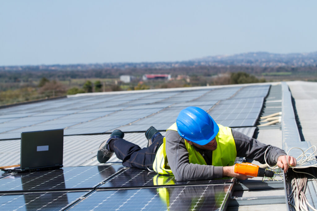fitting photovoltaic panels on a roof  of a building